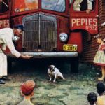 A truck driver tries to coax a dog to move away from his truck.