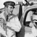 A milkman talking to a woman driver