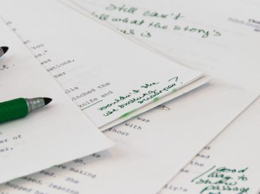 Papers being graded for grammar