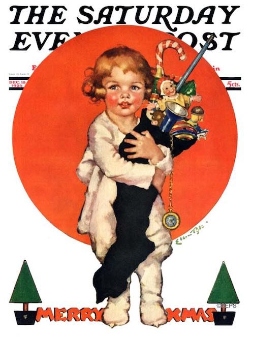 Toddler holding a giant christmas stocking