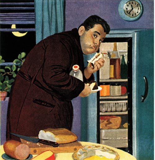 Man eating out of fridge