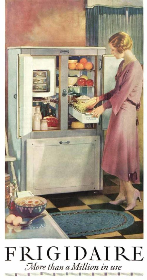 Woman taking food out of a fridge