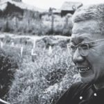 Father Hoa holding an United States care package