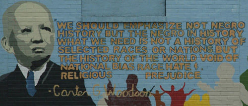 Mural of Carter Woodson. Depicts his face and one of his quotes. 