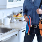 Plumber in a kitchen
