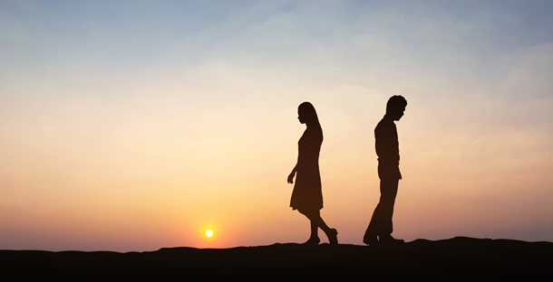 Man and woman walking past eachother