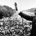 Dr. Martin Luther King Jr. waves to the crowd during the March on Washington