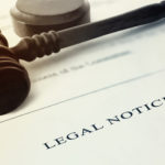 Gavel resting on a legal notice.