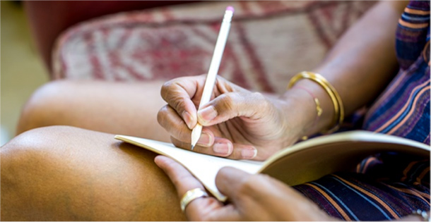 Woman writing in her journal