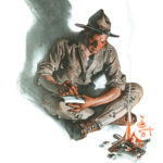 WWI-era American soldier writing a letter by a campfire