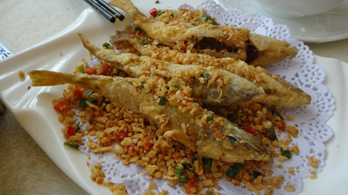 Pieces of fried fish on rice