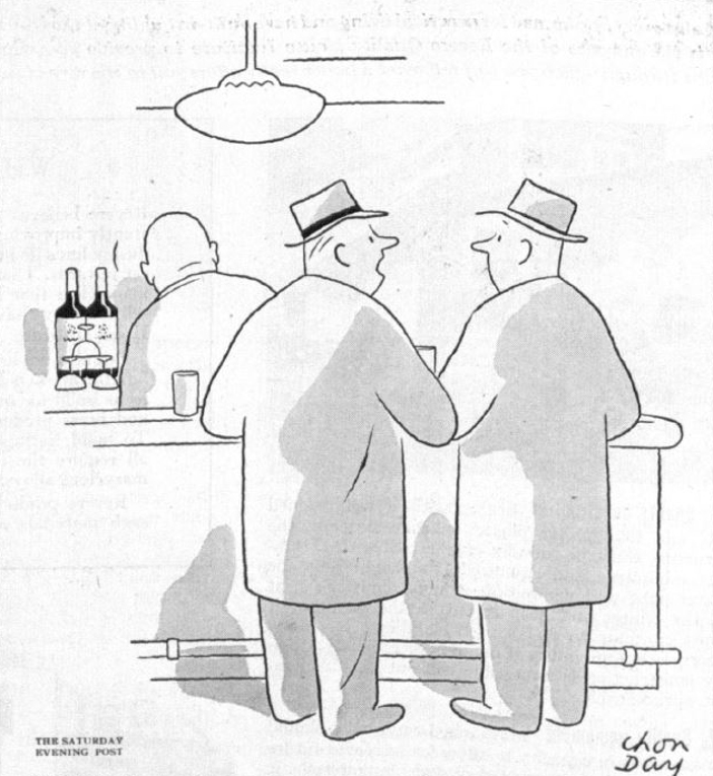 Two men talk in a bar