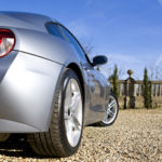 Silver sports car on a driveway