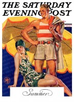 Couple in modern swimming attire under beach umbrella