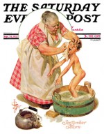 Unhappy boy getting bath in washtub