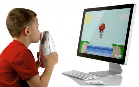 Aerocrine NIOX MINO- boy using device with computer image
