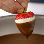 dipping strawberry in chocolate