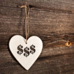 Heart shaped price tag with dollar signs