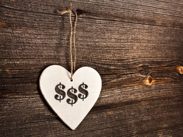 Heart shaped price tag with dollar signs