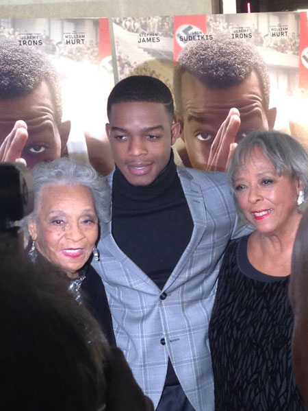 Two of Jesse Owens’ daughters, Gloria Owens Hemphill (left) and Marlene Owens Rankin pose with Race star Stephan James