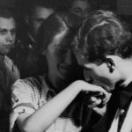 Bill Biega kissing his wife Lili Biega's hand