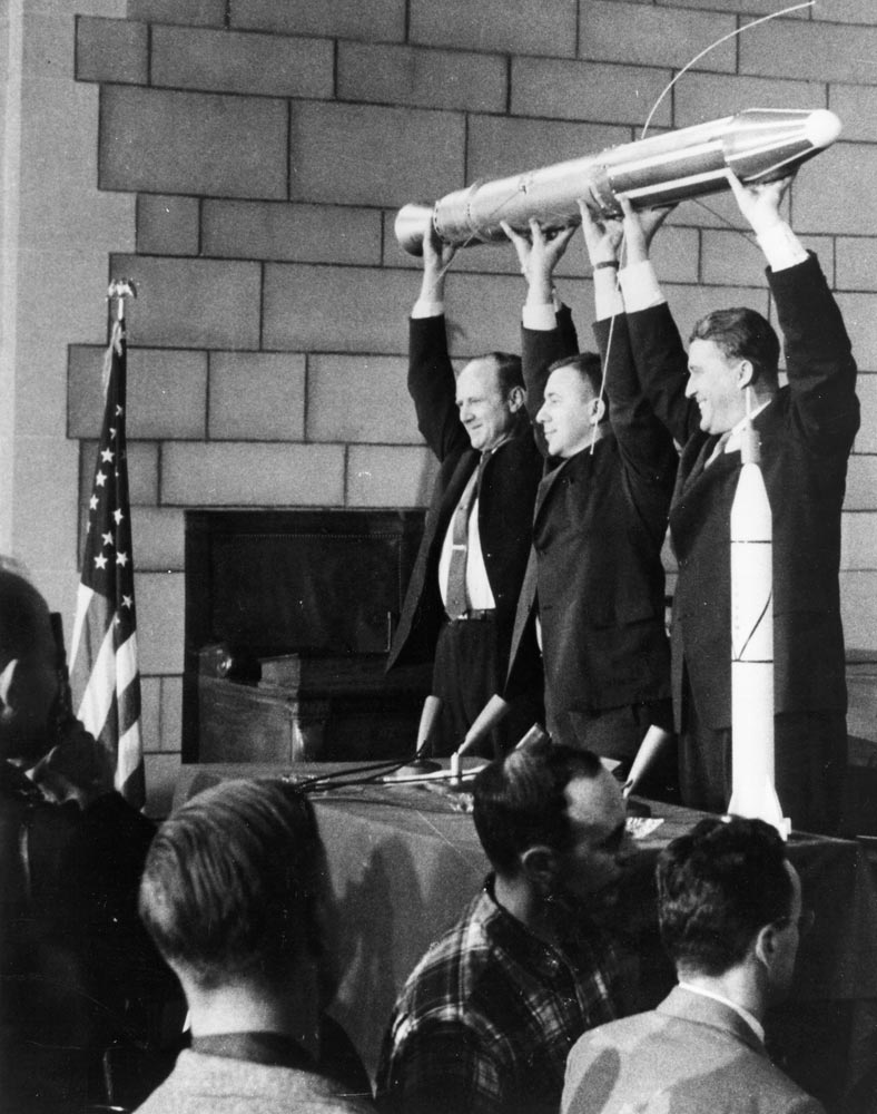 William H. Pickering, former director of Jet Propulsion Laboratory, James A. van Allen, designer of portions of the instrument, and Wernher von Braun, leader of the Army's Redstone National team, lift the Explorer I after its successful 111 days in orbit. Photo credit: NASA.
