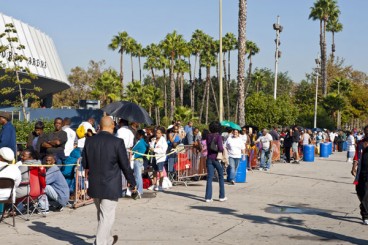 People without medical insurance wait in long lines around the block to see doctors at a free medical clinic at the Sports Arena in Los Angeles in 2011.