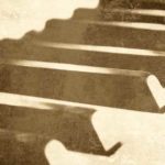 close up of vintage piano keys. Source: Shutterstock.com/ Ensuper
