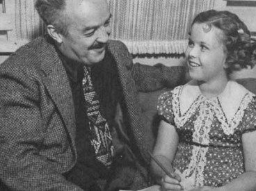 Child star Shirley Temple and The Saturday Evening Post editor J.P. McEvoy in 1938. This photo accompanied the article, "Little Miss Miracle." © SEPS 2014