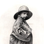 Ad for Unneda Biscuit. Boy in a raincoat.