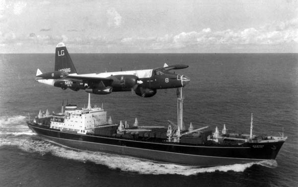 A Navy reconnaisance plane shadows a Russian freighter at the quarantine limit set by the U.S.