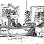 Two lawyers sit in an office; one of them speaks on the phone.