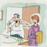 A man is flossing while his wife watches him.