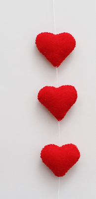 three hearts hanging on a string