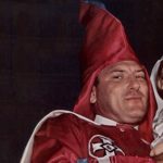 Klansman holding his kid