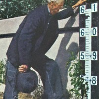 The sixty-one-foot mark at top of levee.