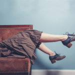 Woman Lying on Couch