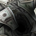 Deep pit in a pile of money