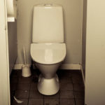 old dirty toilet in restroom.