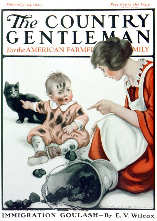 A toddler points to a kitten in an attempt to pin the blame.