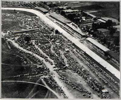 An Airplane View of Autos Parked in the Infield at Indianapolis and of the Twenty-Four Cars Leaving the Tape.