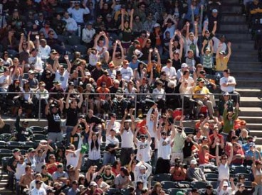 People Performing "the wave" at Baseball Game