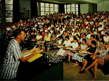 Physicist Walter Steiger lectures students.