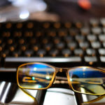 Computer and glasses by by Mike Saechang