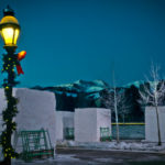 mountain backdrop with lamp post and 12-foot, 20-ton blocks of snow at night