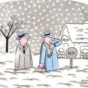 Two men wait for a bus during a snow storm.