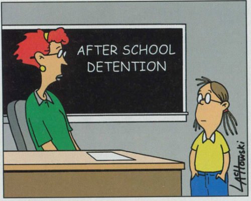 A principal speaks to a student in detention hall.