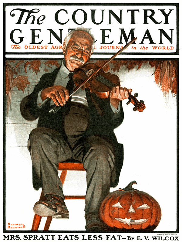 Elder man playing a violin on his porch next to a lit Jack-O'-Lantern