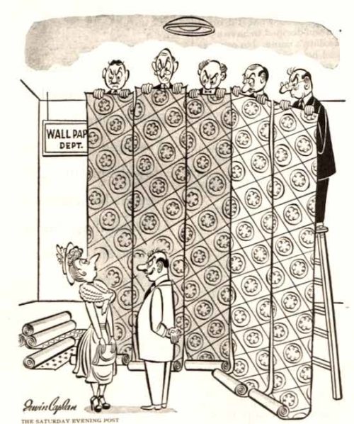 A customer views wallpaper being held by five salesmen on step ladders.