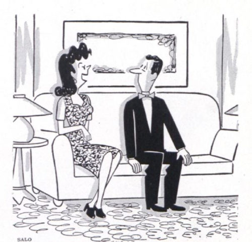 A woman talks to her date on a couch